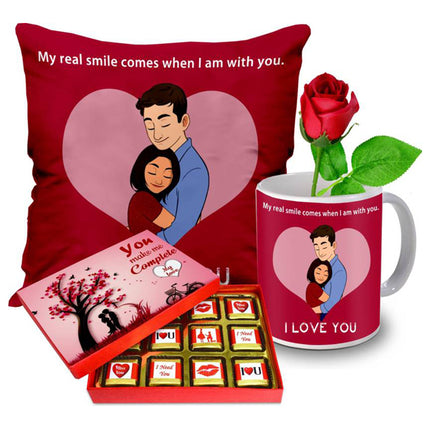 Valentine gift set featuring premium chocolates, a romantic printed mug, rose and a soft heart cushion – perfect for expressing love to your partner.