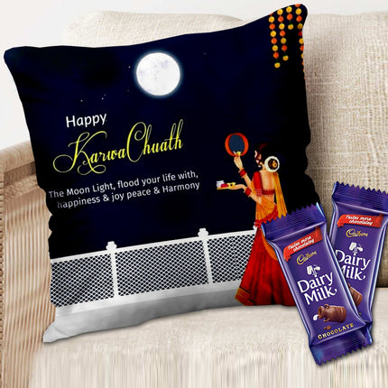 Decorative pillow with 'Happy Karwa Chauth' text and two Cadbury Dairy Milk chocolate bars on a couch.