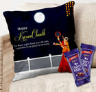 Decorative pillow with 'Happy Karwa Chauth' text and two Cadbury Dairy Milk chocolate bars on a couch.