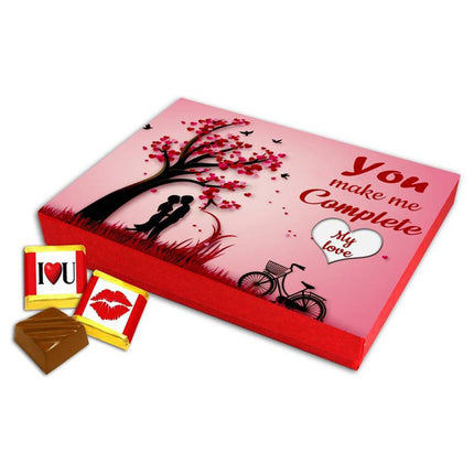 Valentine gift set featuring premium chocolates, a romantic printed mug, rose and a soft heart cushion – perfect for expressing love to your partner.