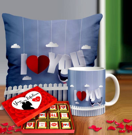 Valentine gift set featuring premium chocolates, a romantic printed mug, and a soft cushion – perfect for expressing love to your partner.