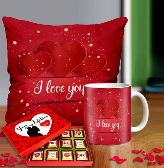 Valentine gift set featuring premium chocolates, a romantic printed mug, and a soft cushion – perfect for expressing love to your partner.