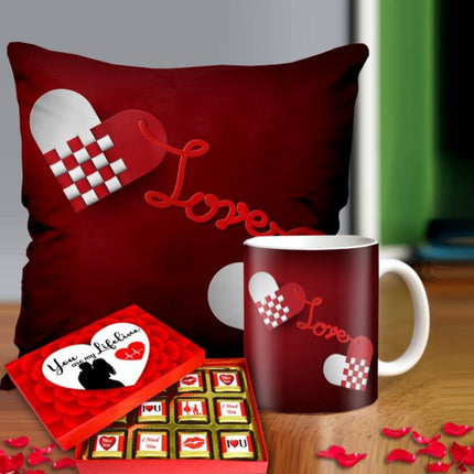 Valentine gift set featuring premium chocolates, a romantic printed mug, and a soft cushion – perfect for expressing love to your partner.