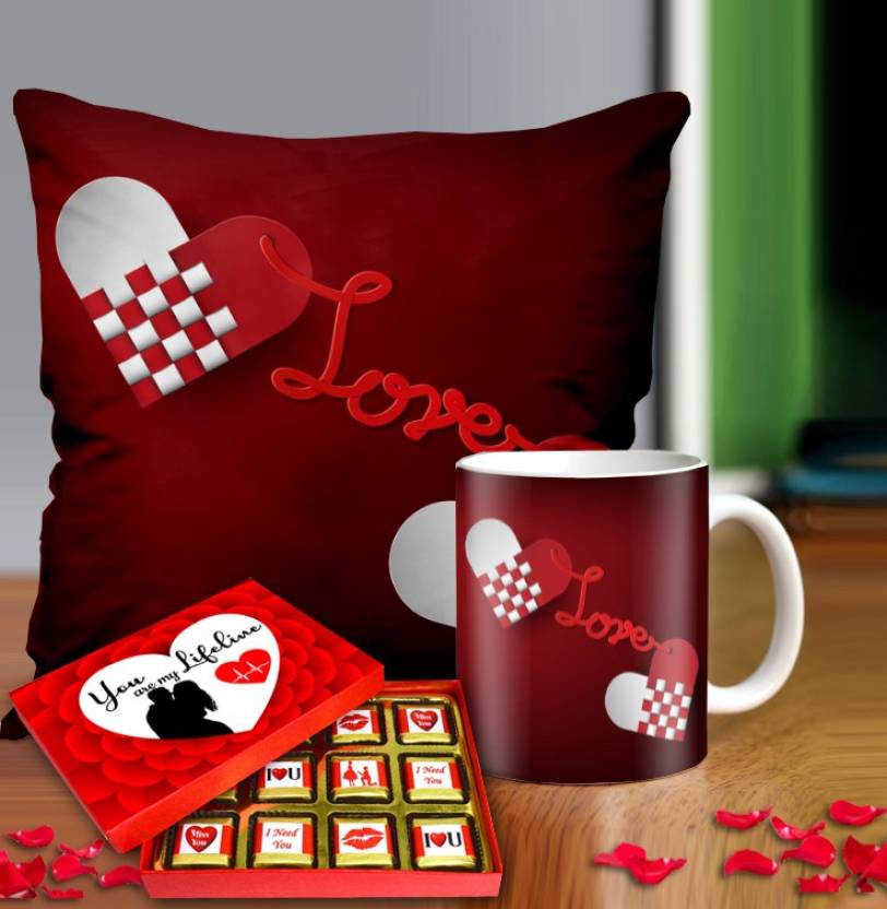 Valentine gift set featuring premium chocolates, a romantic printed mug, and a soft cushion – perfect for expressing love to your partner.