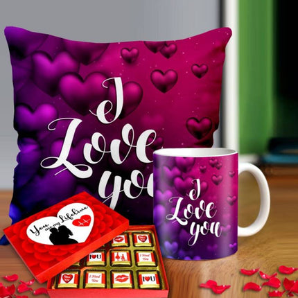Valentine gift set featuring premium chocolates, a romantic printed mug, and a soft cushion – perfect for expressing love to your partner.