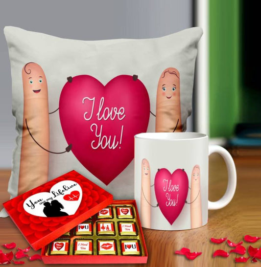 Valentine gift set featuring premium chocolates, a romantic printed mug, and a soft cushion – perfect for expressing love to your partner.