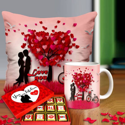 Valentine gift set featuring premium chocolates, a romantic printed mug, and a soft cushion – perfect for expressing love to your partner.
