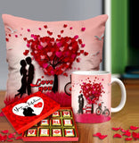 Valentine gift set featuring premium chocolates, a romantic printed mug, and a soft cushion – perfect for expressing love to your partner.