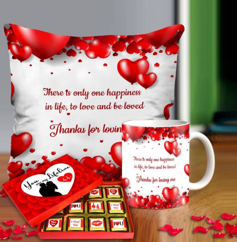 Valentine gift set featuring premium chocolates, a romantic printed mug, and a soft cushion – perfect for expressing love to your partner.