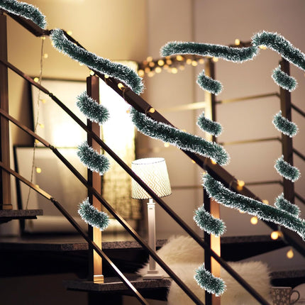 Decorative green garland on a staircase with warm lighting in the background
Christmas decoration items
Home decor for Christmas