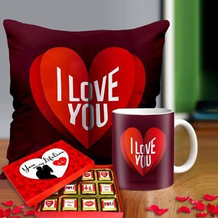 Valentine gift set featuring premium chocolates, a romantic printed mug, and a soft cushion – perfect for expressing love to your partner.