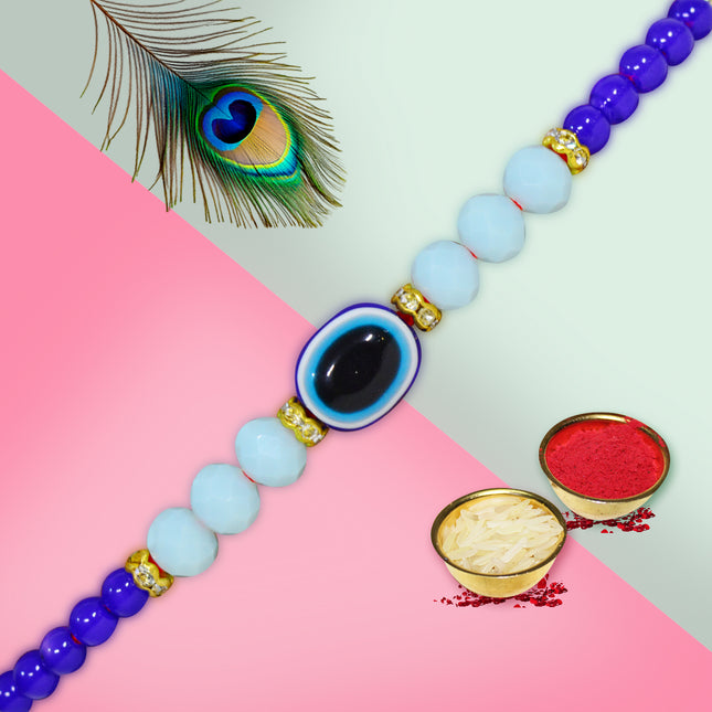 Elegant Rakhi with feather-inspired design and gemstone detailing, symbolizing grace, protection, and sibling love.