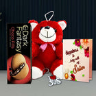 Red teddy bear, box of Dark Fantasy chocolate, I love sis keychain, and card 